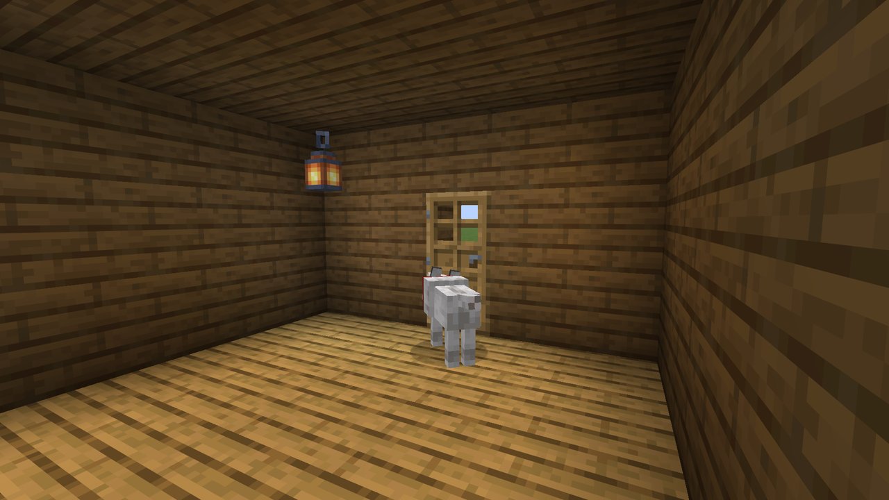 A dog sitting by a door