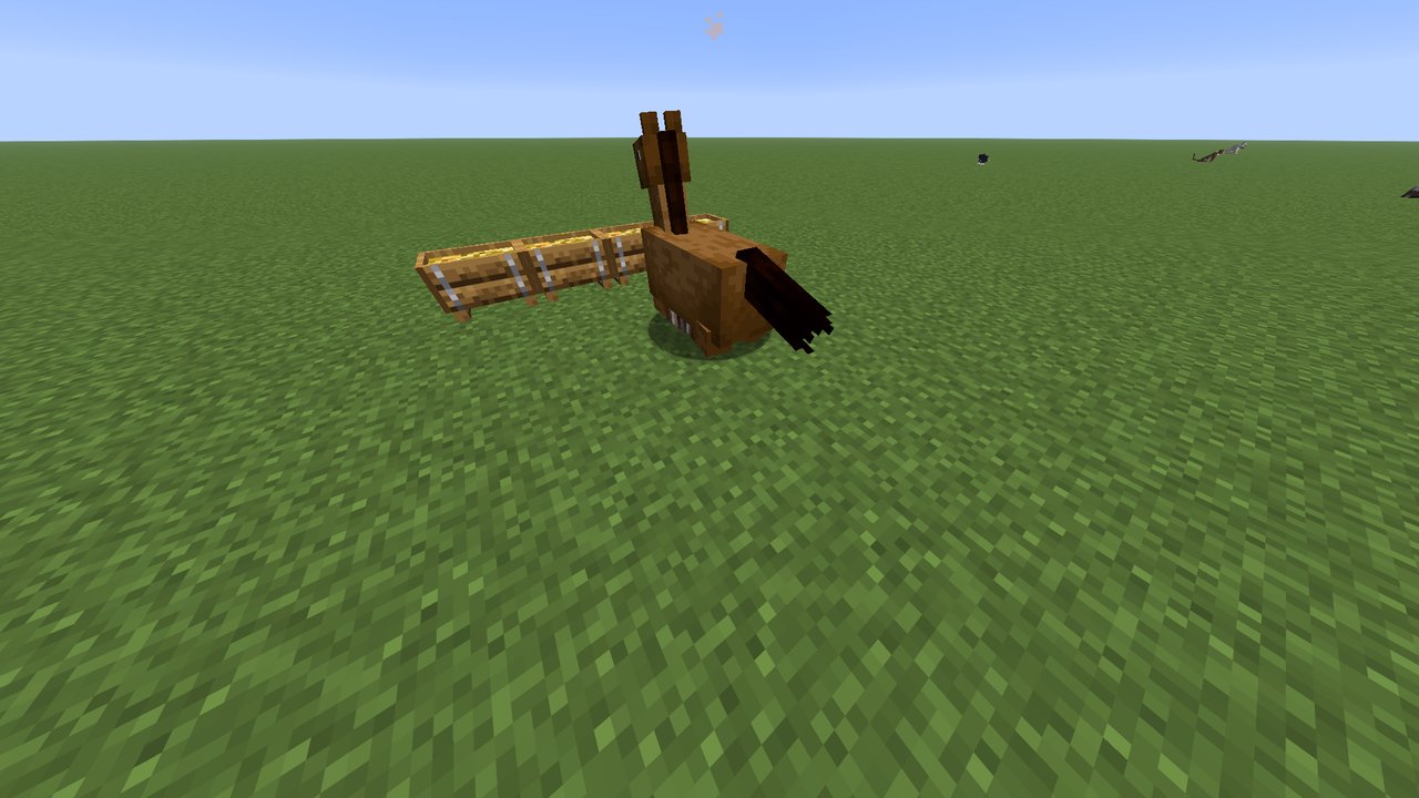A horse lying down to sleep next to its trough.