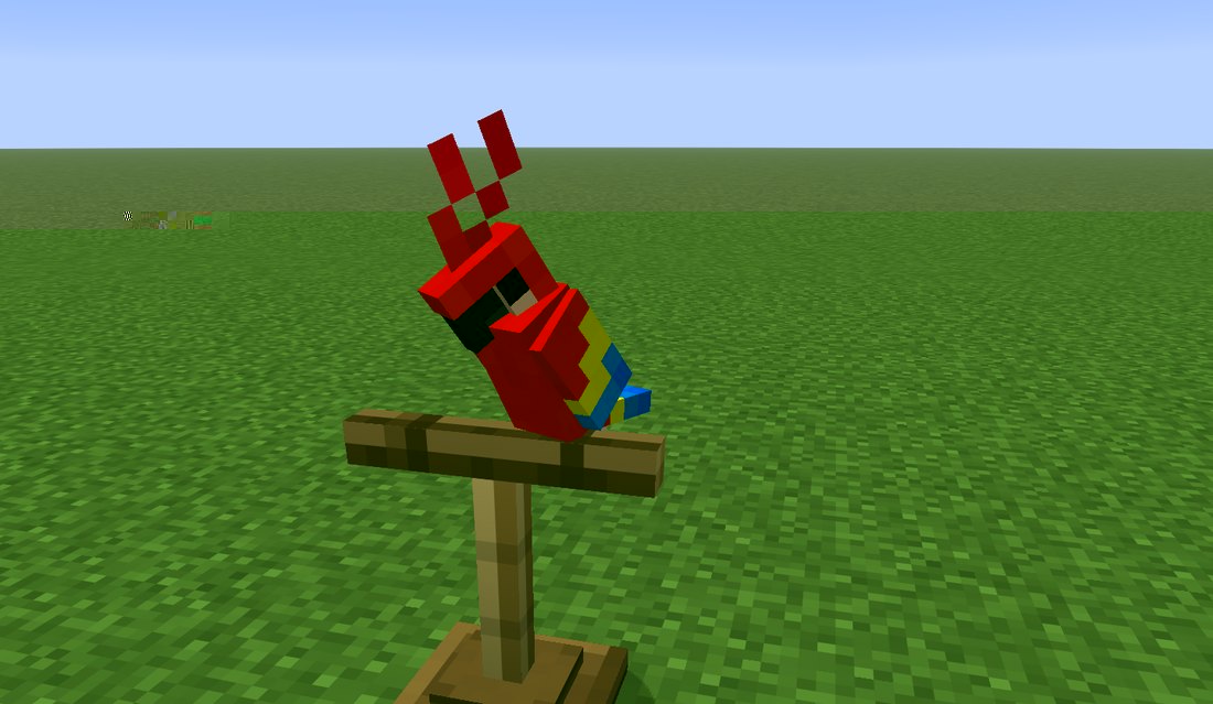 A parrot on a bird perch
